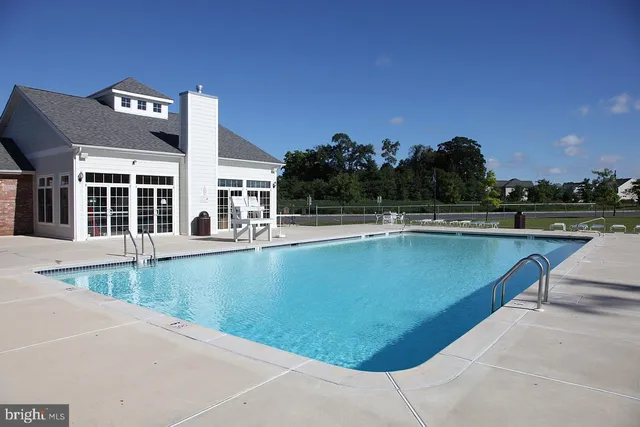 a view of swimming pool with a yard