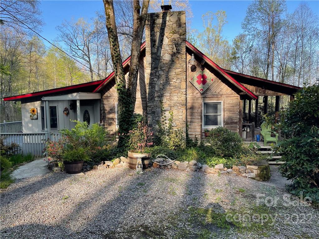 988 Brandywine Road Waynesville, NC 28786 - Photo 1 of 3 a view of house with a yard and potted plants