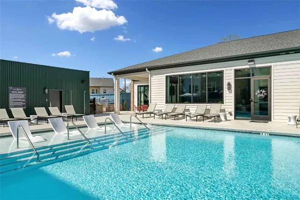 a view of a house with swimming pool