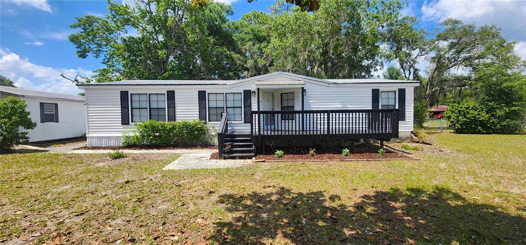 19865 Southwest 5th Place Dunnellon, FL 34431 - Photo 5 of 78 a view of a house with a yard