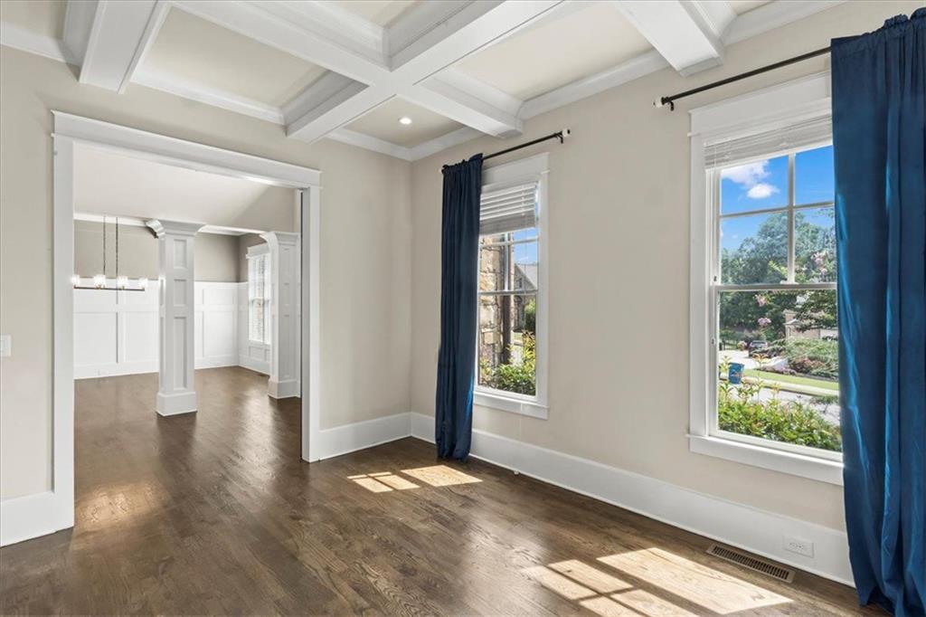 2996 Cambridge Hill Drive Dacula, GA 30019 - Photo 11 of 49 a view of an empty room with wooden floor and a window