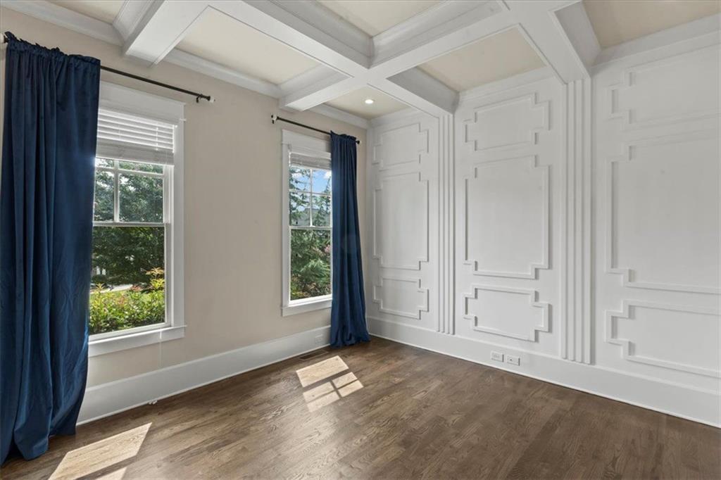 2996 Cambridge Hill Drive Dacula, GA 30019 - Photo 12 of 49 an empty room with wooden floor and windows