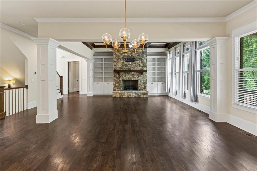 2996 Cambridge Hill Drive Dacula, GA 30019 - Photo 16 of 49 a view of a room with wooden floor fireplace and windows