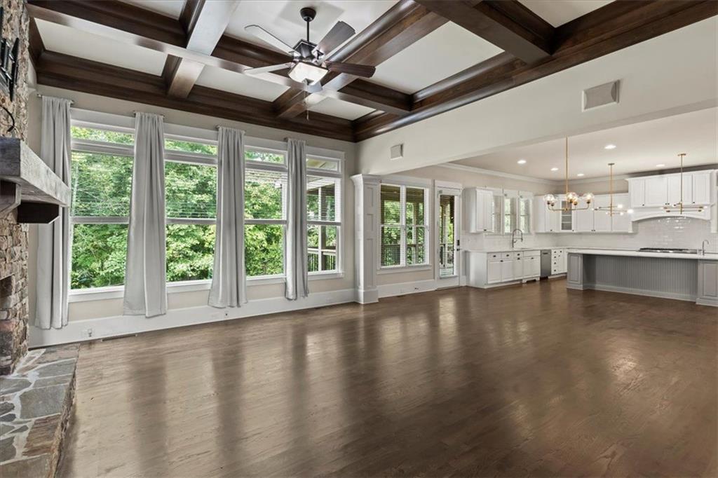 2996 Cambridge Hill Drive Dacula, GA 30019 - Photo 17 of 49 a view of an empty room with wooden floor and a window