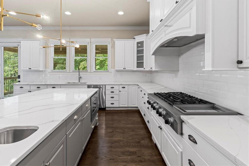 2996 Cambridge Hill Drive Dacula, GA 30019 - Photo 20 of 49 a kitchen with a sink stove and cabinets