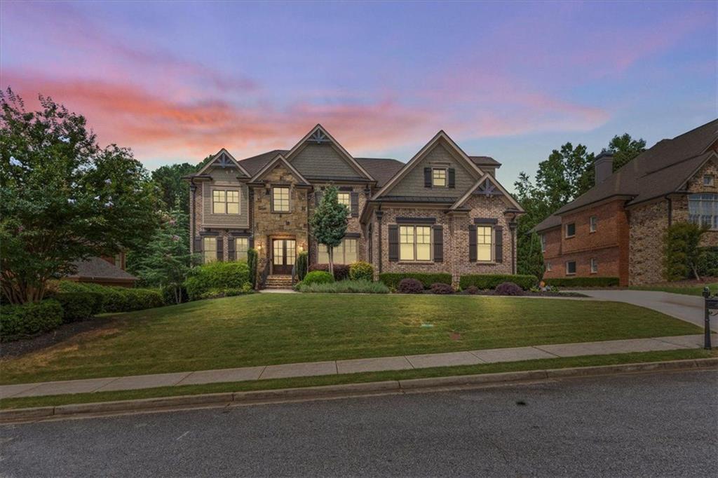 2996 Cambridge Hill Drive Dacula, GA 30019 - Photo 2 of 49 a front view of a house with a yard