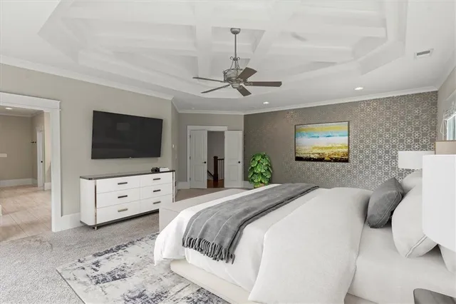 a bedroom with a bed and a flat screen tv on dresser