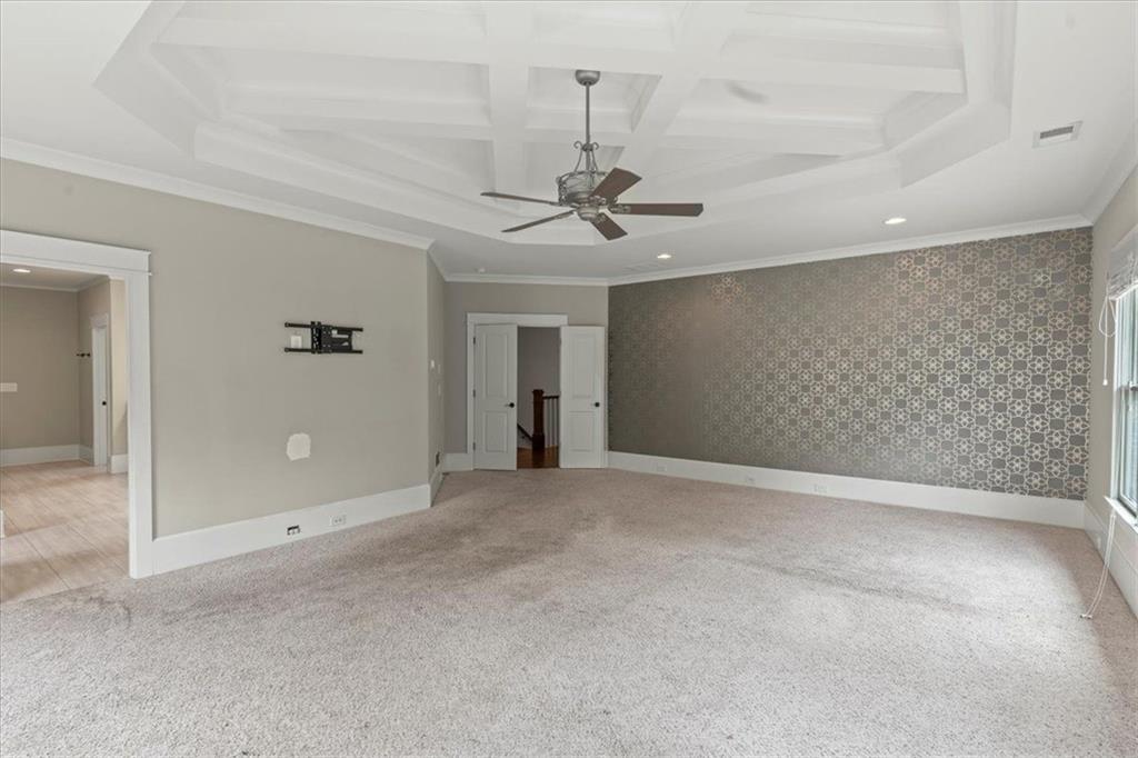 2996 Cambridge Hill Drive Dacula, GA 30019 - Photo 22 of 49 an empty room with a ceiling fan and a window