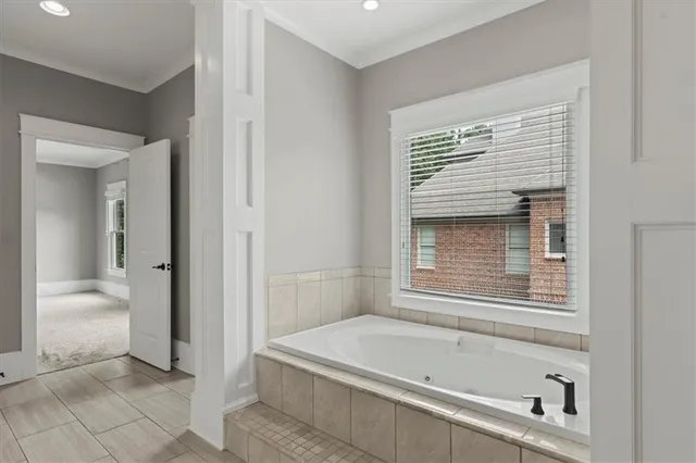 a en suite bathroom with a bathtub and a shower