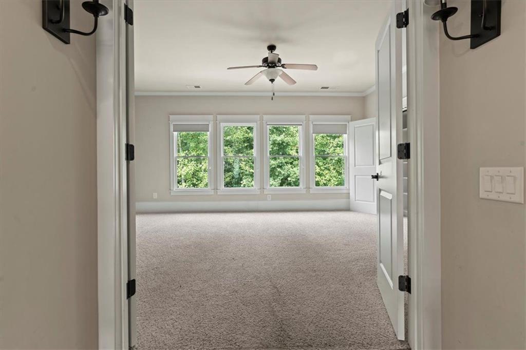2996 Cambridge Hill Drive Dacula, GA 30019 - Photo 27 of 49 a view of hallway with windows and chandelier