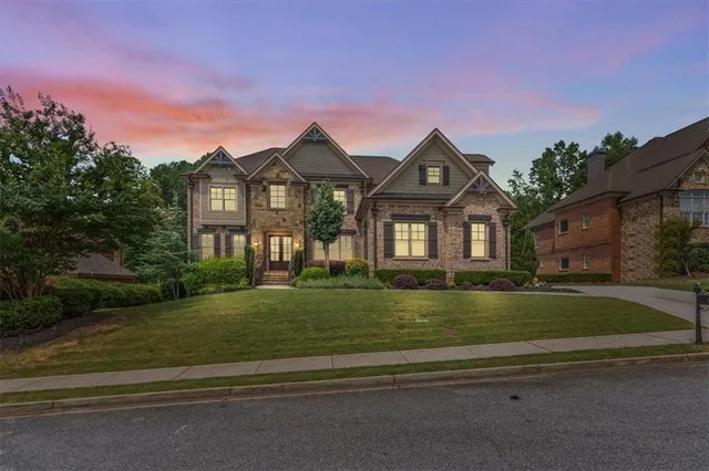 a front view of a house with a yard