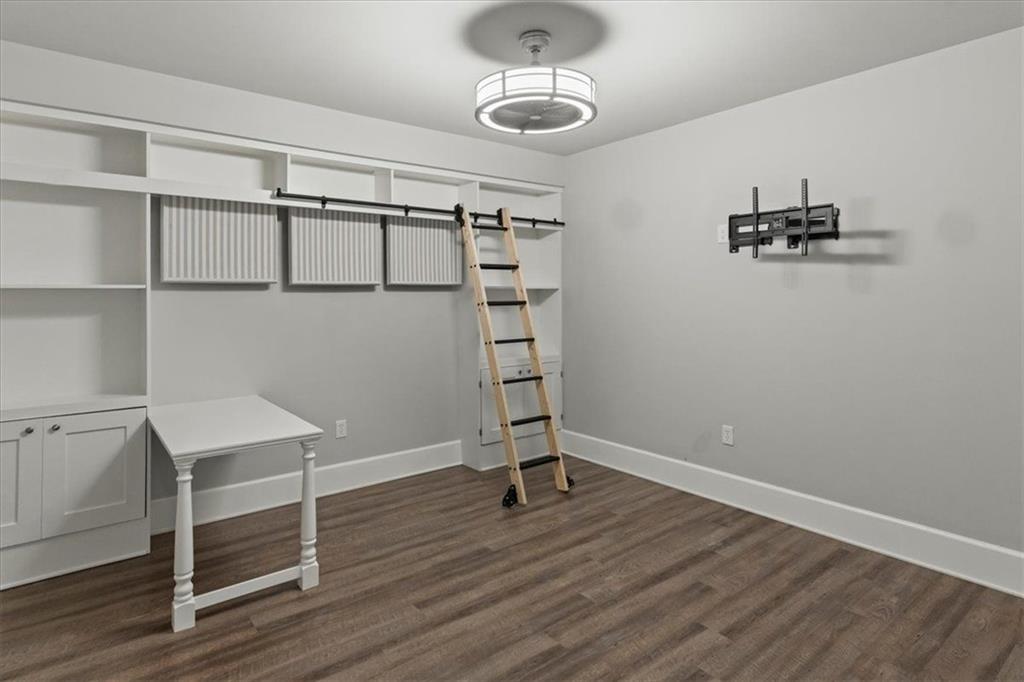 2996 Cambridge Hill Drive Dacula, GA 30019 - Photo 33 of 49 a view of a room with wooden floor and cabinet