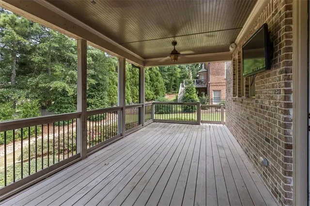 a view of a porch with wooden floor
