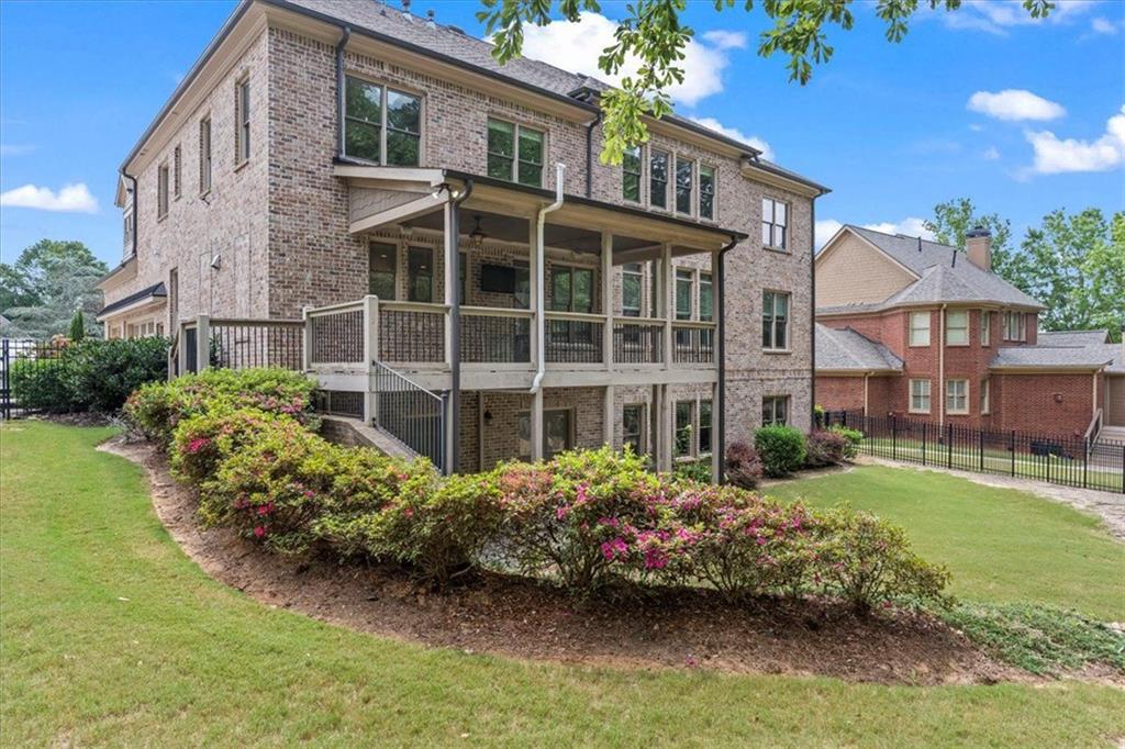 2996 Cambridge Hill Drive Dacula, GA 30019 - Photo 40 of 49 a front view of a house with a garden and plants