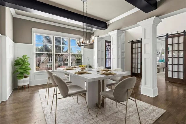 a view of a dining room with furniture and wooden floor