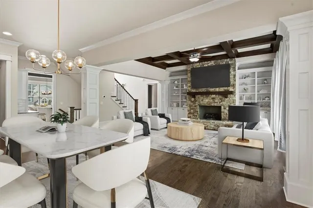 a living room with fireplace furniture and a flat screen tv