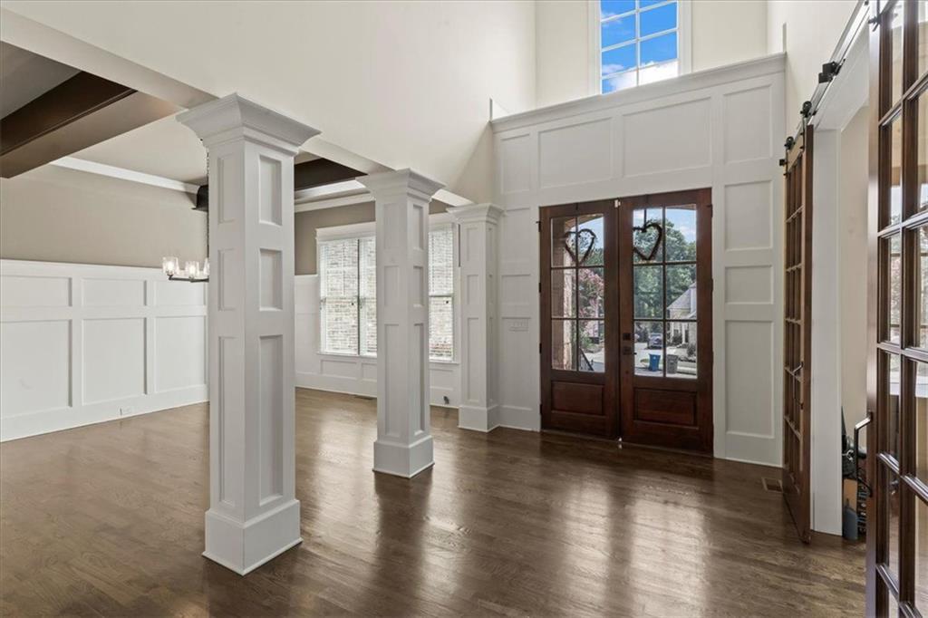 2996 Cambridge Hill Drive Dacula, GA 30019 - Photo 8 of 49 a view of a hallway with wooden floor and windows