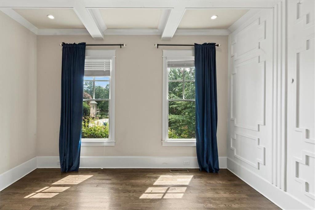 2996 Cambridge Hill Drive Dacula, GA 30019 - Photo 10 of 49 an empty room with wooden floor and windows