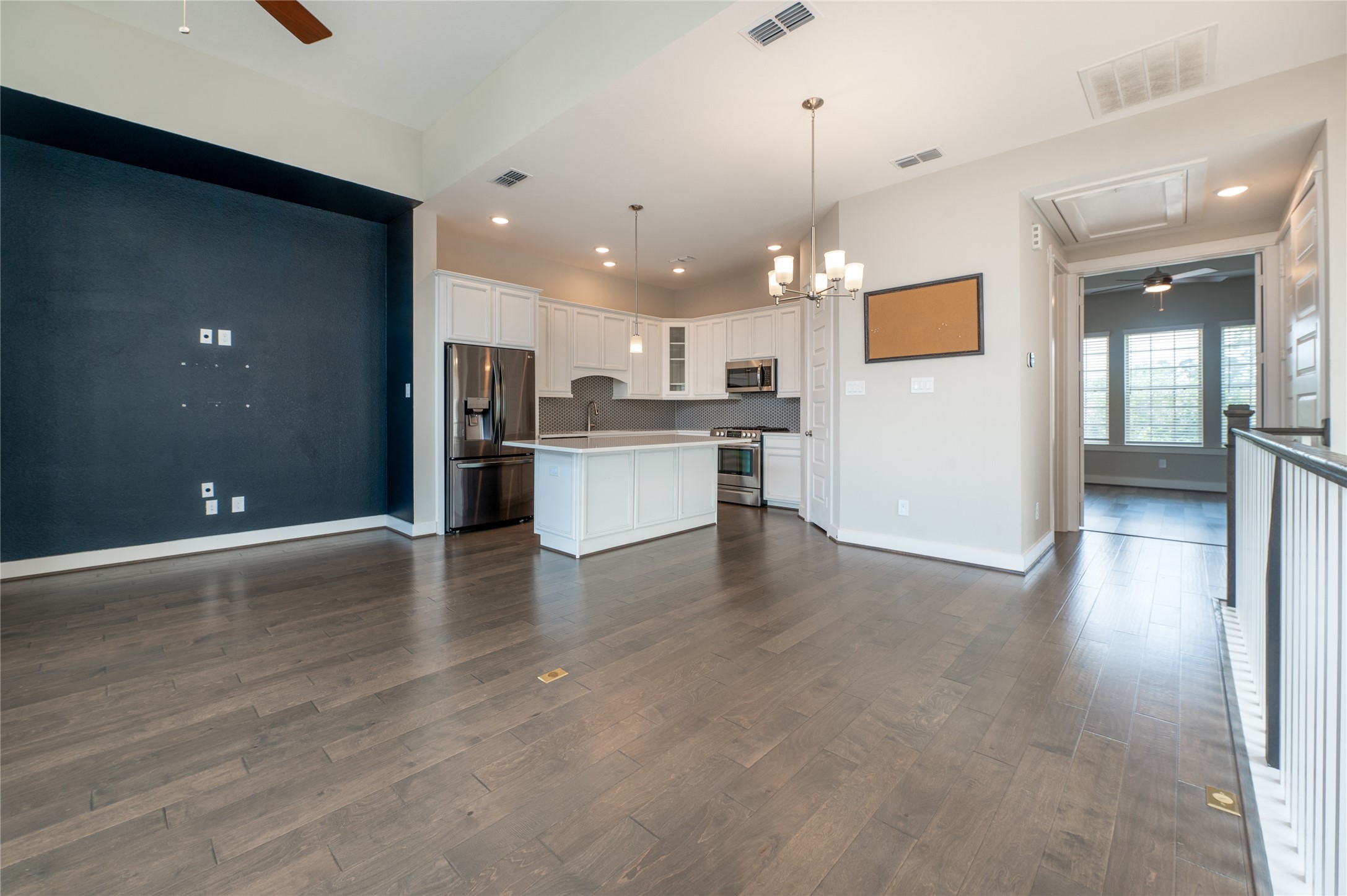 963 Lilly Flower Lane Houston, TX 77091 - Photo 28 of 28 Open floor plan living room and kitchen on the second floor