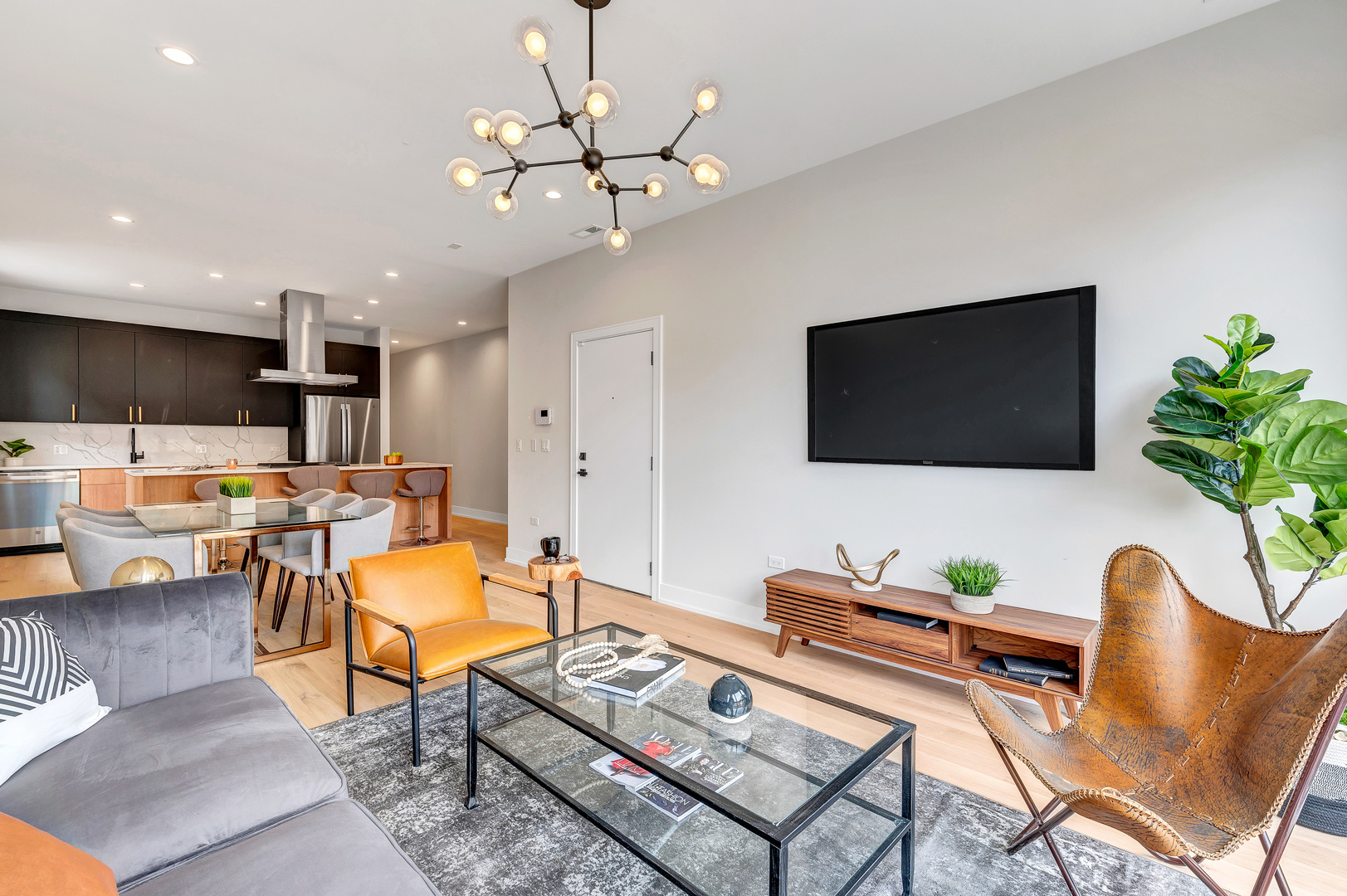2341 West Adams Street, Unit 4W Chicago, IL 60612 - Photo 2 of 15 a living room with furniture and a flat screen tv