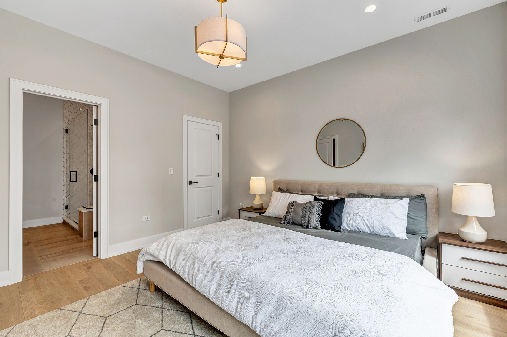 2341 West Adams Street, Unit 4W Chicago, IL 60612 - Photo 7 of 15 a bedroom with a bed and a chandelier