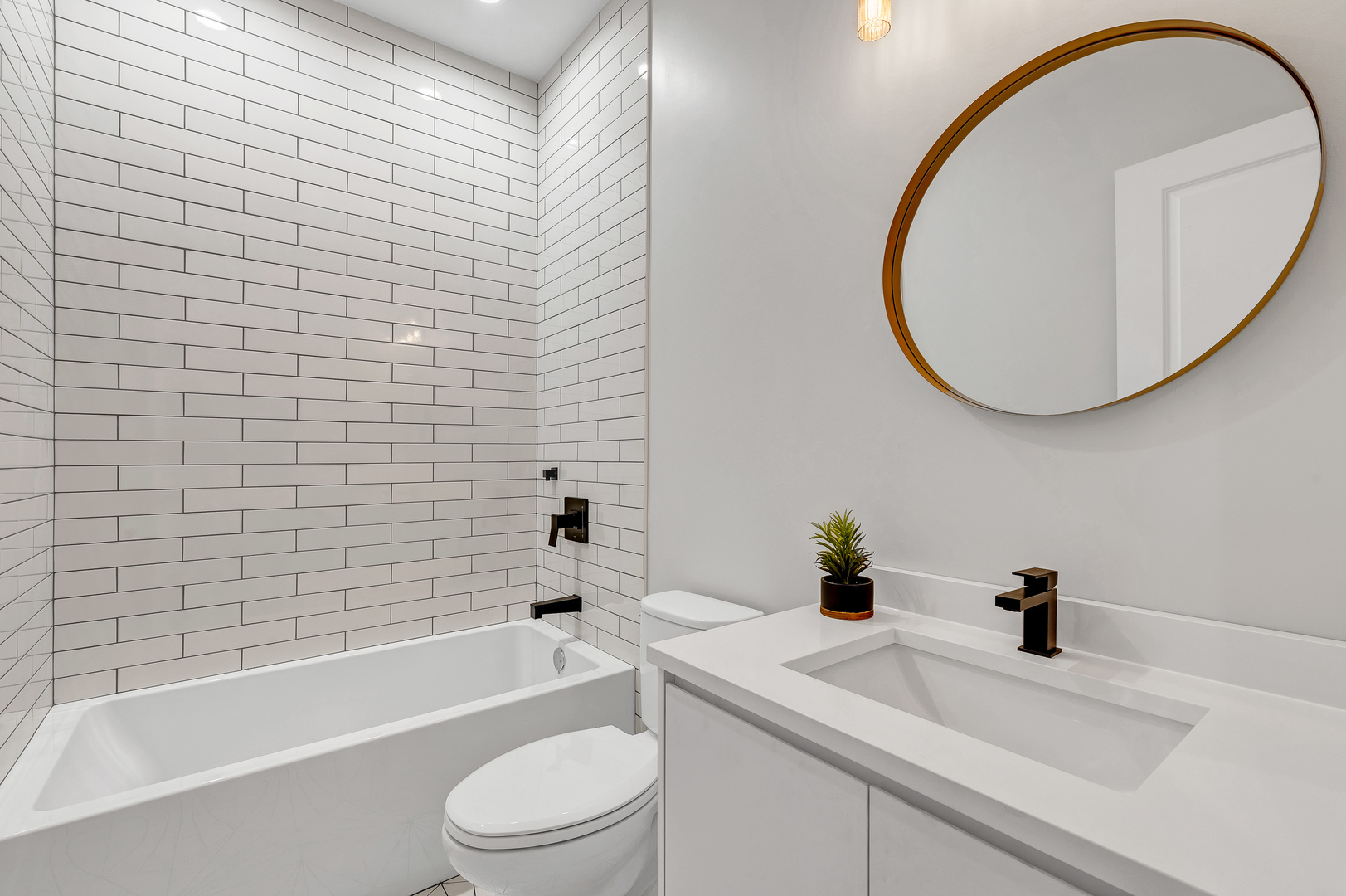 2341 West Adams Street, Unit 4W Chicago, IL 60612 - Photo 10 of 15 a bathroom with a sink a toilet and a bathtub