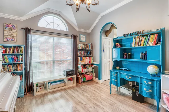 a view of a workspace with furniture and toys