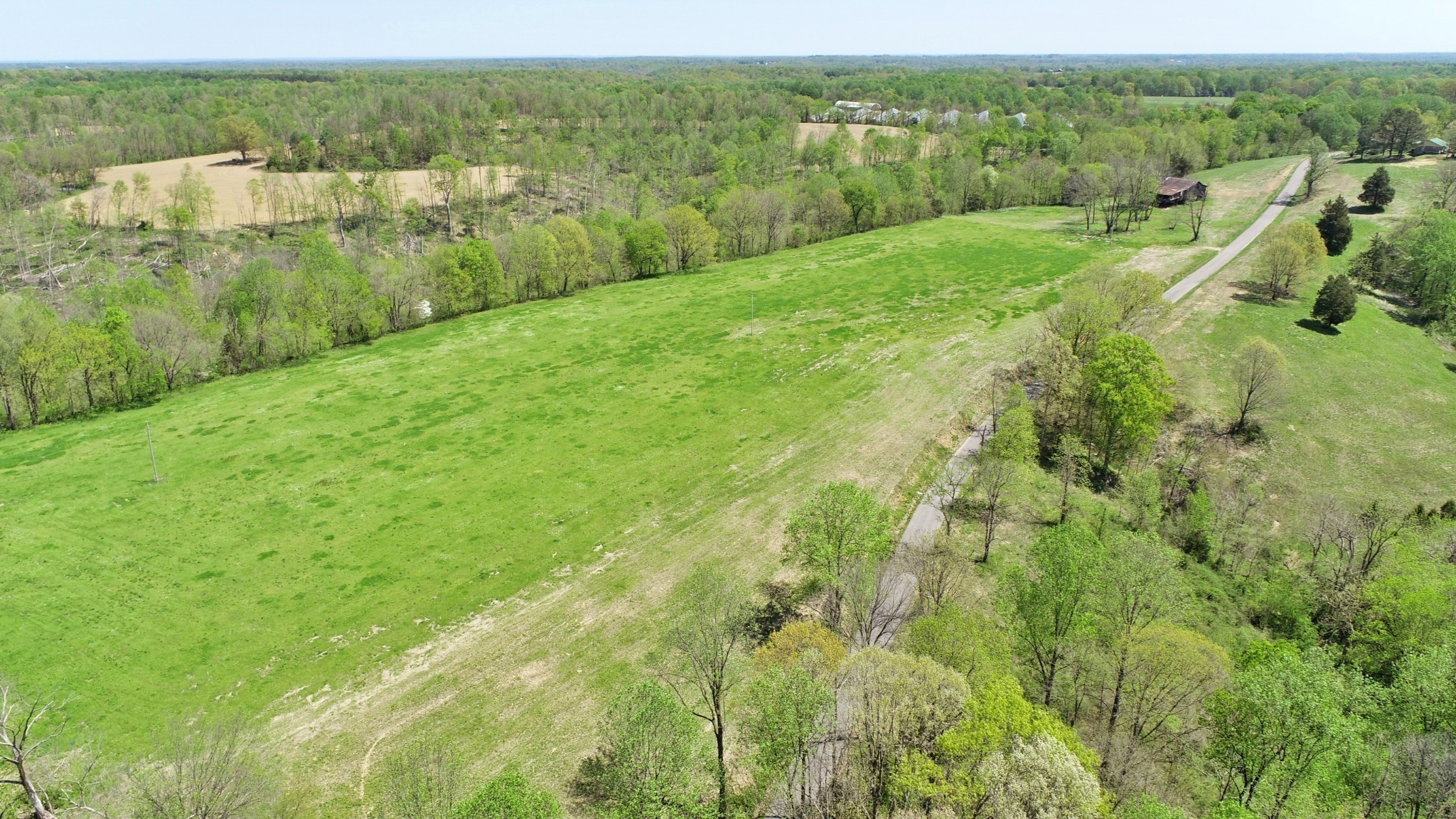 22 Wixtown Road Westmoreland, TN 37186 - Photo 4 of 7 a view of a lush green outdoor space with a lake view