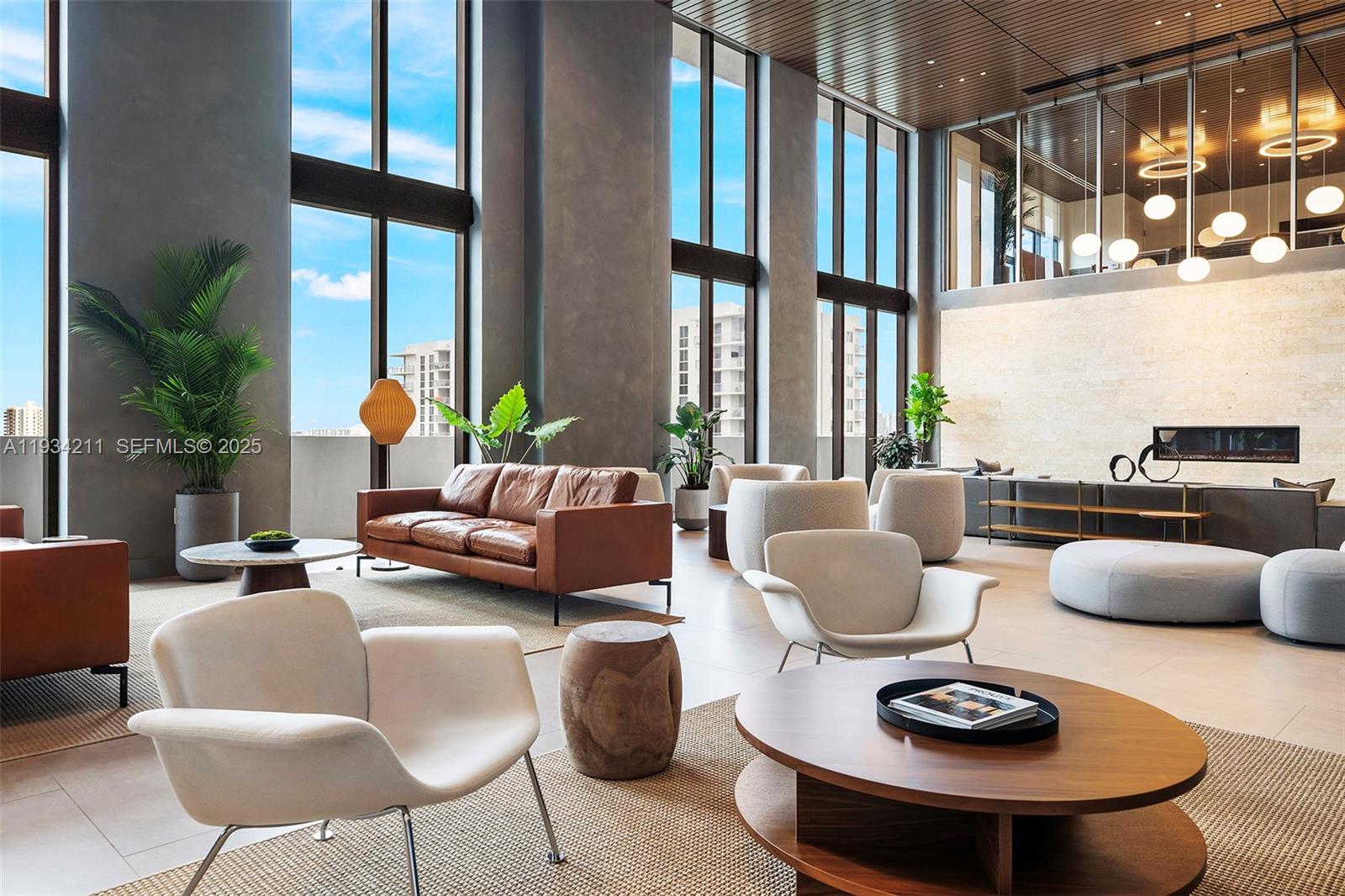 2800 Southwest 27th Terrace, Unit 1918 Miami, FL 33133 - Photo 11 of 15 a living room with furniture and a large window