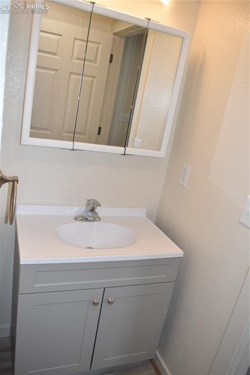 805 Raton Avenue La Junta, CO 81050 - Photo 13 of 26 a bathroom with a sink and a mirror