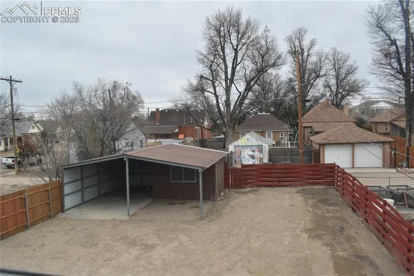 a view of a dinning table and chairs in the patio