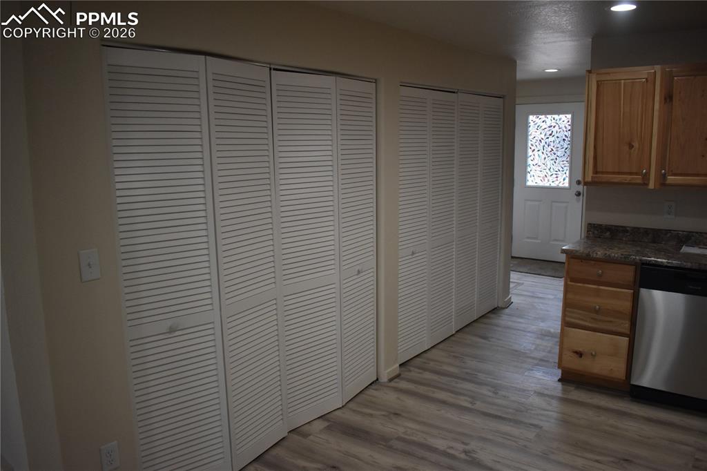 805 Raton Avenue La Junta, CO 81050 - Photo 8 of 26 a kitchen with stainless steel appliances wooden floor and mountain view