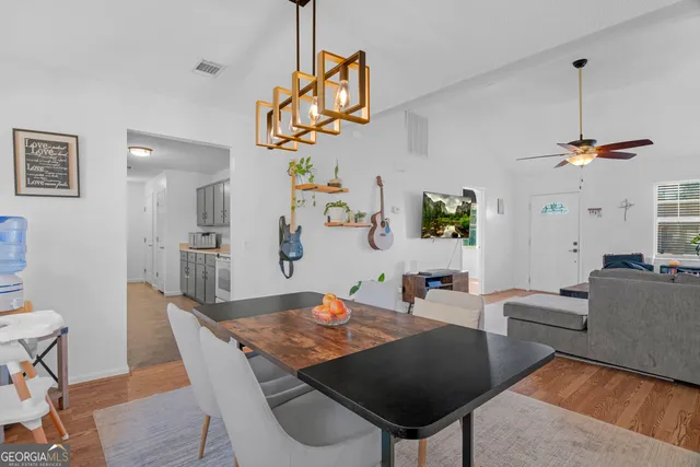 a view of a dining room with furniture