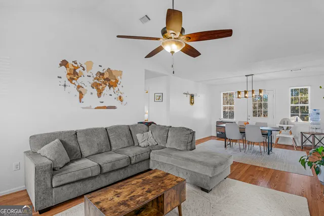 a living room with furniture and a window