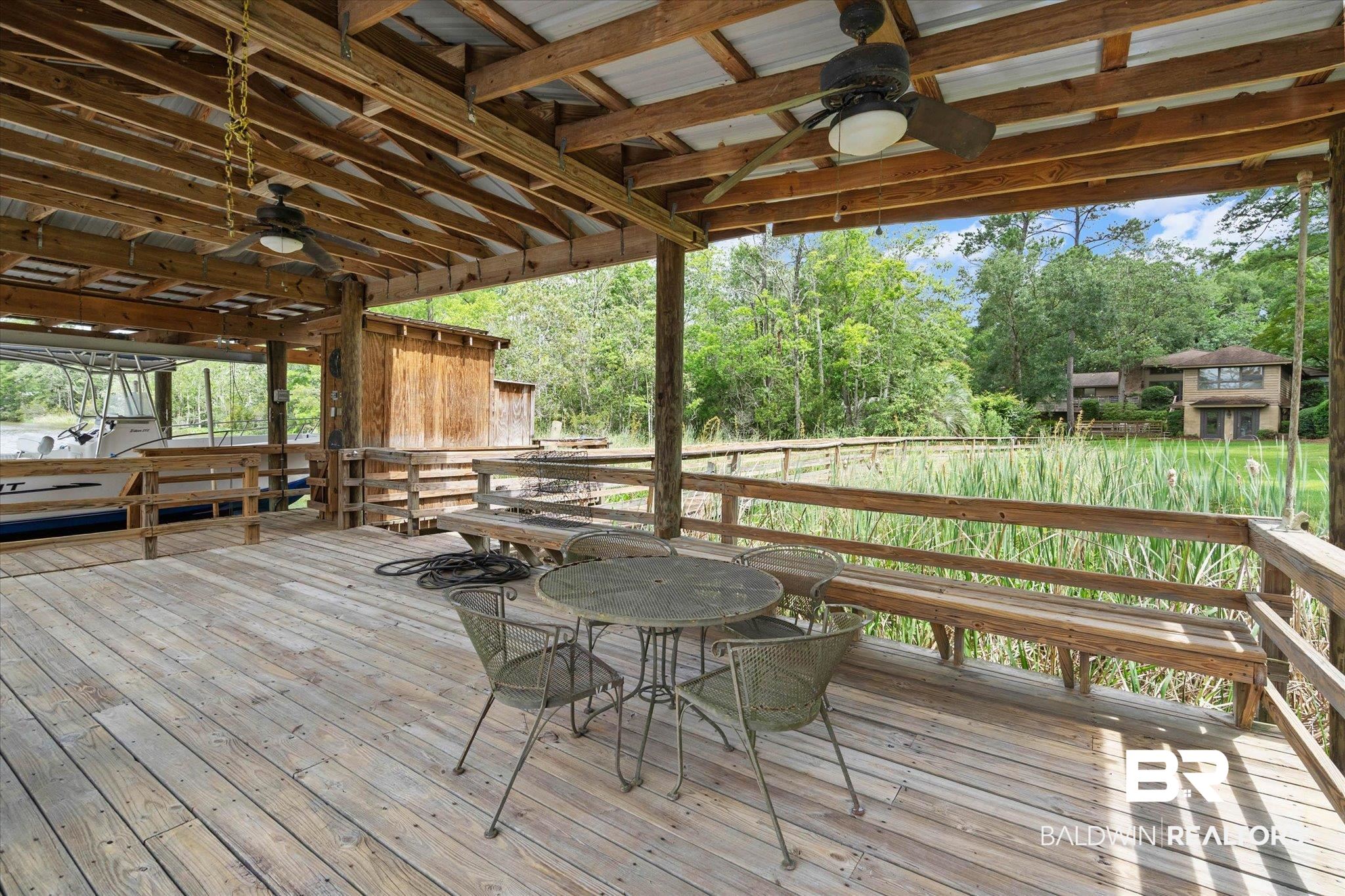 3500 Venetia Road Mobile, AL 36605 - Photo 41 of 56 Expansive covered dock featuring natural wood decking and structural elements