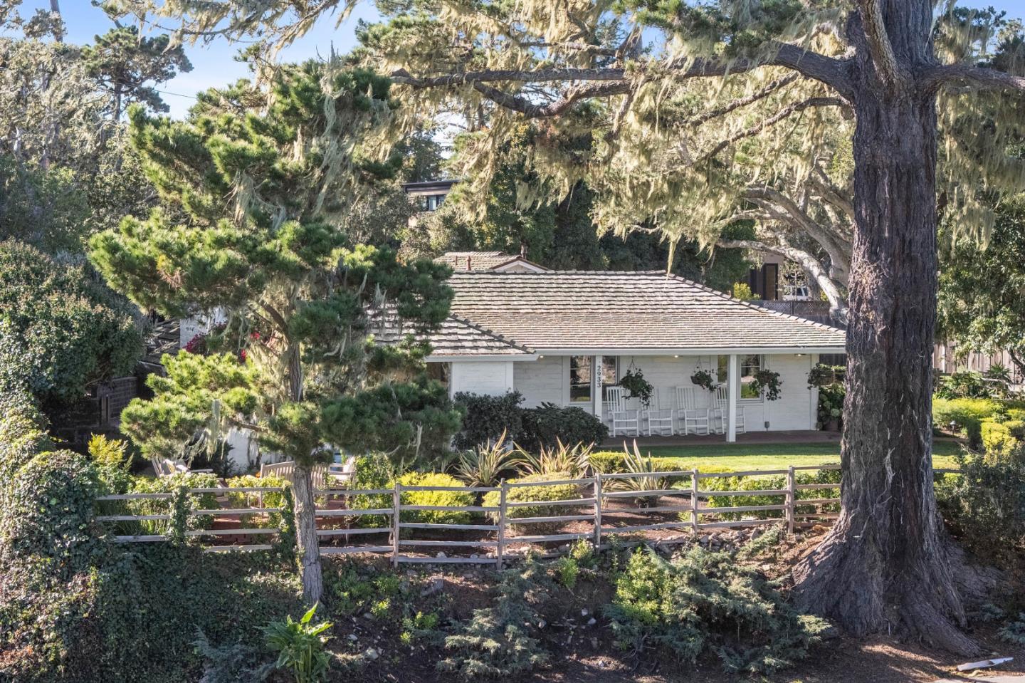 2933 Old 17 Mile Drive Pebble Beach, CA 93953 - Photo 11 of 19 a view of a swimming pool with a patio