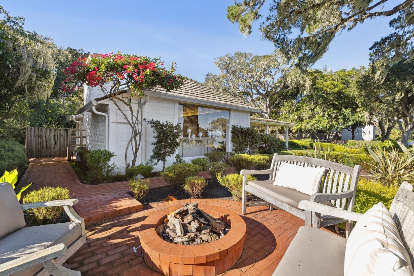 2933 Old 17 Mile Drive Pebble Beach, CA 93953 - Photo 8 of 19 a view of a patio with couches table and chairs and potted plants