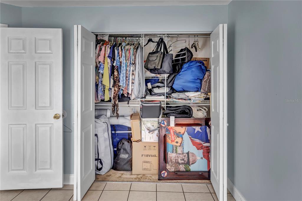 3117 Ludlow Drive New Port Richey, FL 34655 - Photo 14 of 20 a view of walk in closet with clothes and shoes