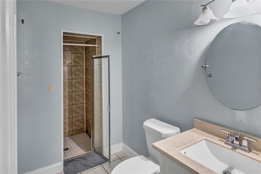 3117 Ludlow Drive New Port Richey, FL 34655 - Photo 15 of 20 a bathroom with a sink a toilet and shower