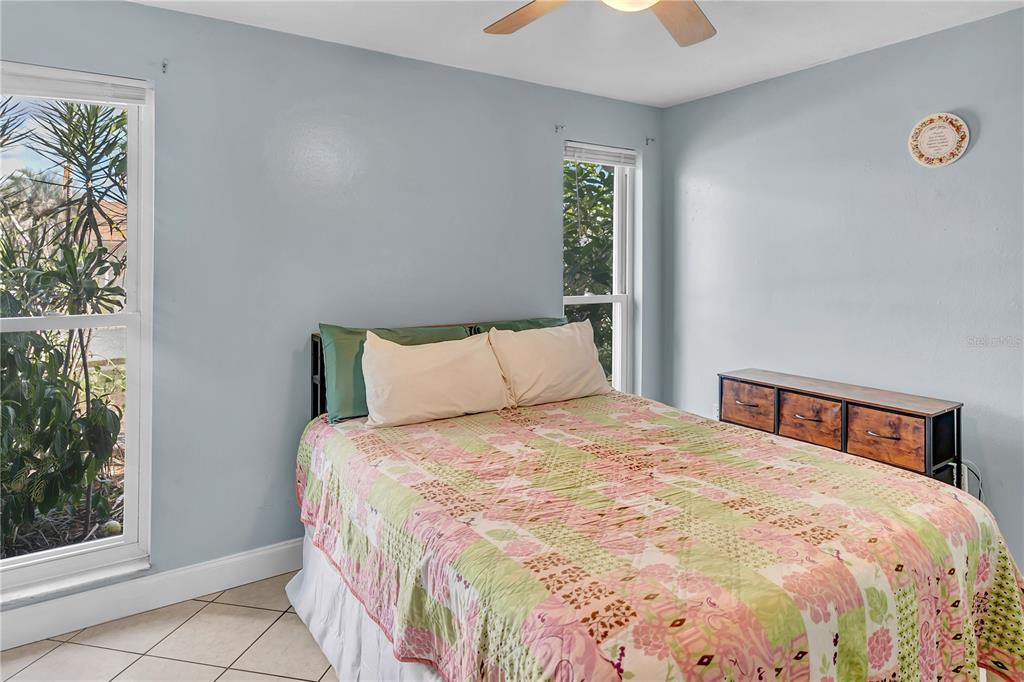 3117 Ludlow Drive New Port Richey, FL 34655 - Photo 17 of 20 a large bed sitting in a bedroom next to a window