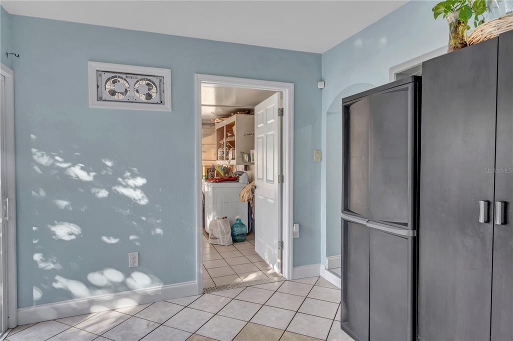 3117 Ludlow Drive New Port Richey, FL 34655 - Photo 20 of 20 a view of a refrigerator in kitchen and an empty room