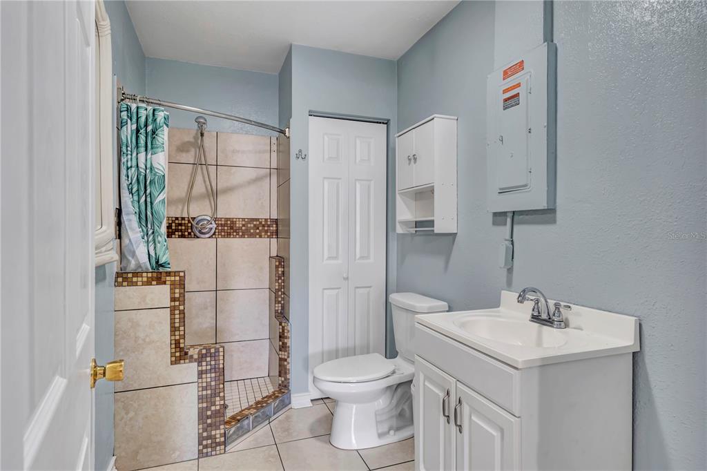 3117 Ludlow Drive New Port Richey, FL 34655 - Photo 10 of 20 a bathroom with a sink a toilet and shower