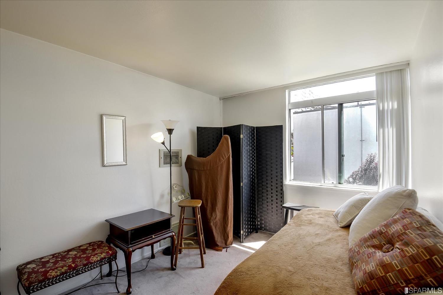 50 Inca Lane, Unit 5 San Francisco, CA 94115 - Photo 19 of 33 a bedroom with a bed and a mirror