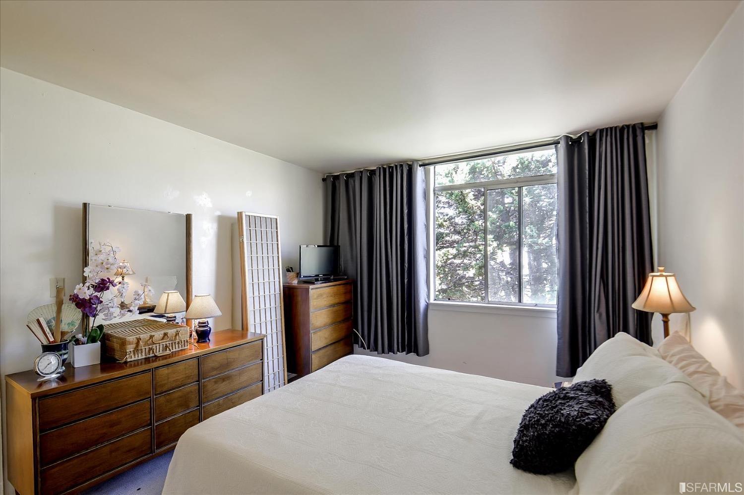 50 Inca Lane, Unit 5 San Francisco, CA 94115 - Photo 24 of 33 a bedroom with a bed potted plant on dresser and a window