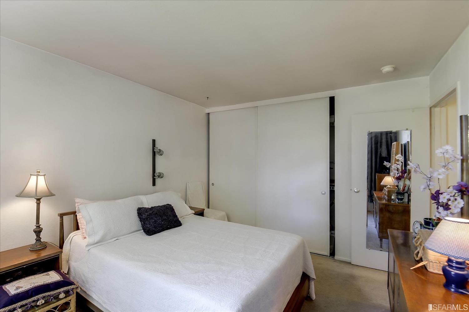 50 Inca Lane, Unit 5 San Francisco, CA 94115 - Photo 26 of 33 a bedroom with a bed and a lamp on table