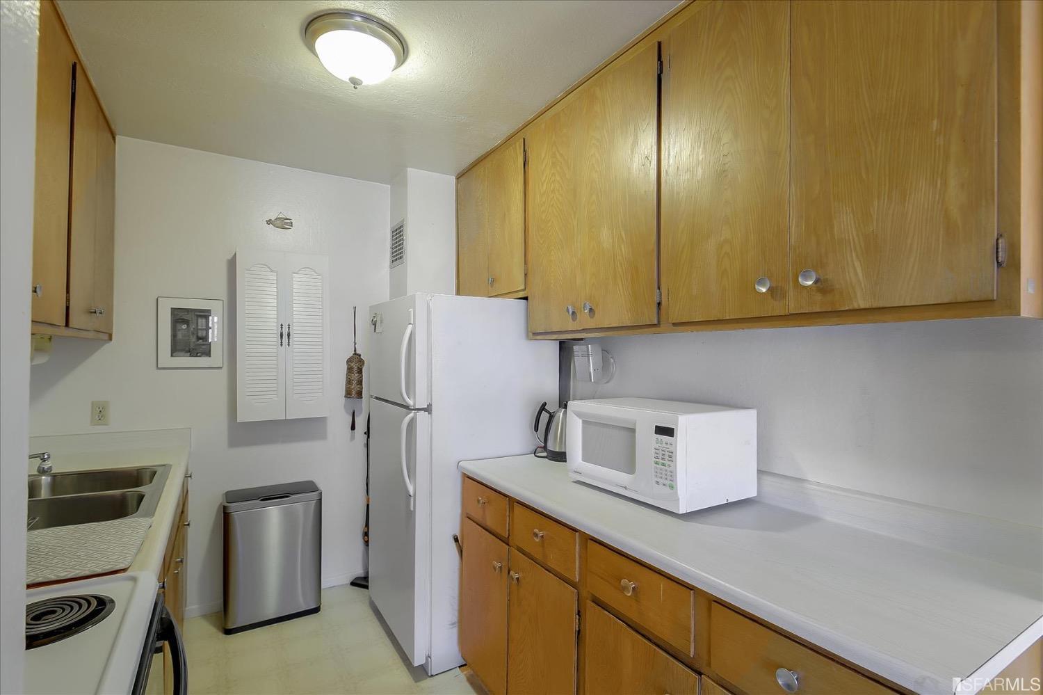 50 Inca Lane, Unit 5 San Francisco, CA 94115 - Photo 6 of 33 a kitchen with stainless steel appliances granite countertop a refrigerator sink and stove