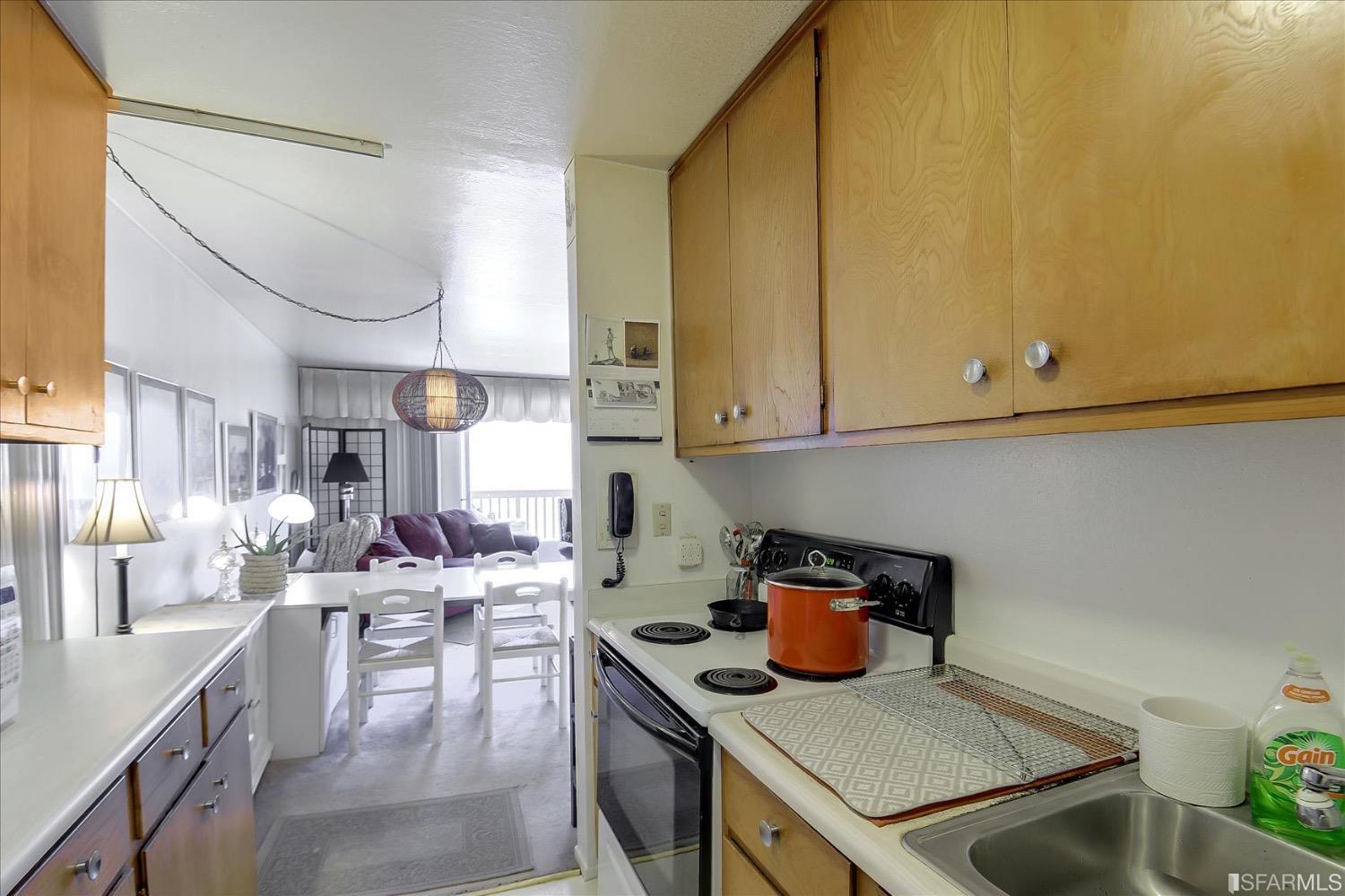 50 Inca Lane, Unit 5 San Francisco, CA 94115 - Photo 9 of 33 a kitchen with stainless steel appliances granite countertop a sink a stove and a refrigerator