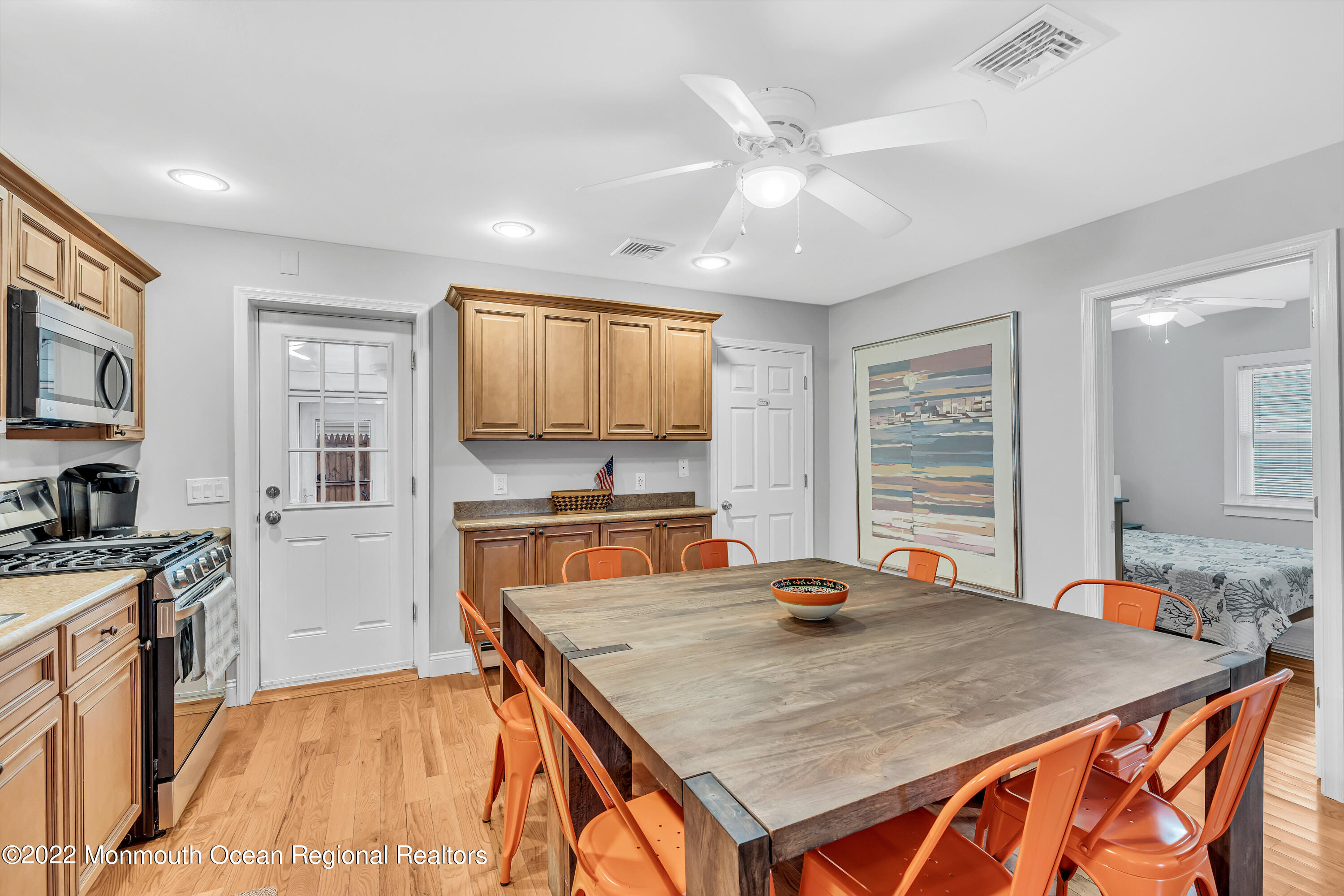 57 Fielder Avenue Seaside Heights, NJ 08751 - Photo 15 of 31 a kitchen with stainless steel appliances granite countertop a stove refrigerator sink and cabinets