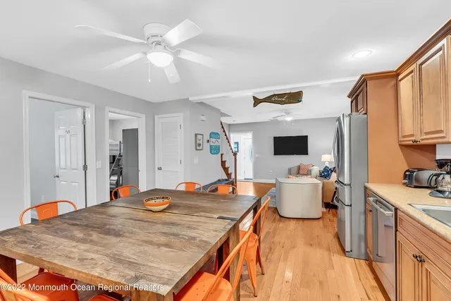 a bed room with a bed and a kitchen