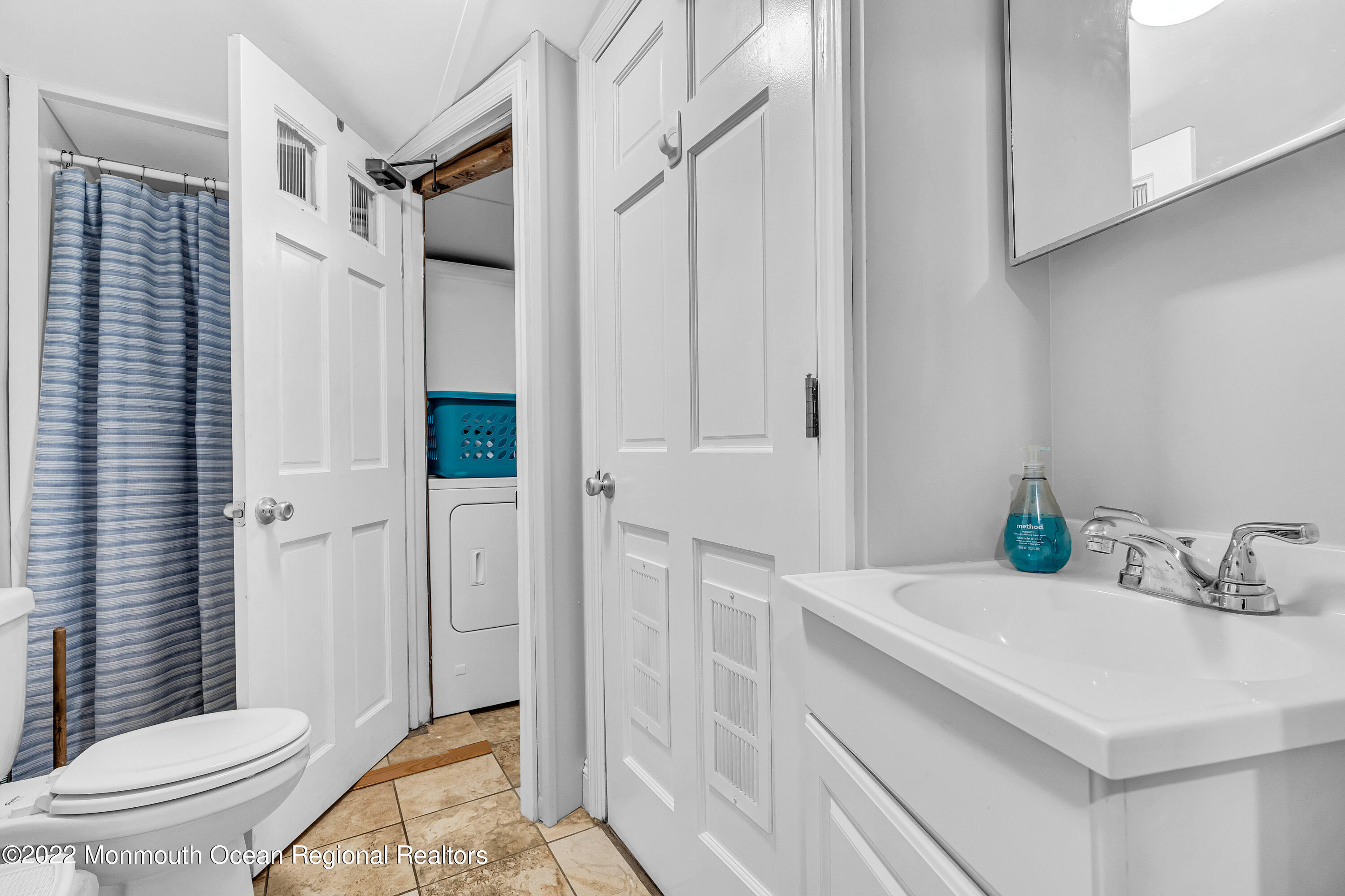 57 Fielder Avenue Seaside Heights, NJ 08751 - Photo 17 of 31 a bathroom with a sink a toilet and shower